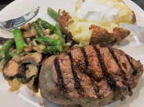 tenderloin steak with baked potato and mixed veggies